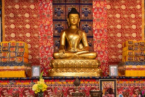 Buddhist Meditation Group Big golden Buddha statue in the meditation shrine hall.