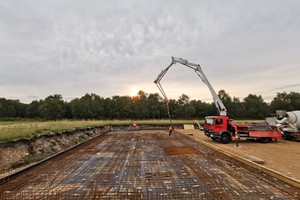 Buddhist Temple Foundations Big crane laying the foundations of a Tibetan Buddhist Temple in England.