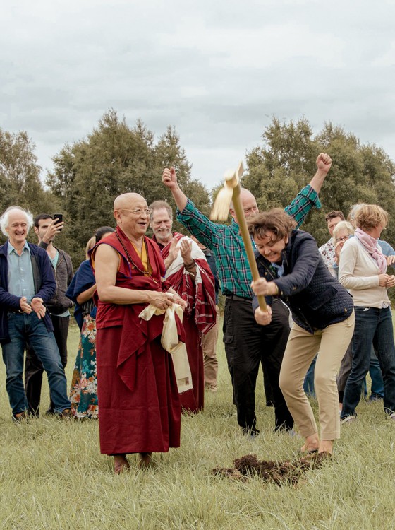 Tibetan Buddhist Meditation Master and group of volunteers breaking ground to build foundations of a Buddhist Temple in the UK.