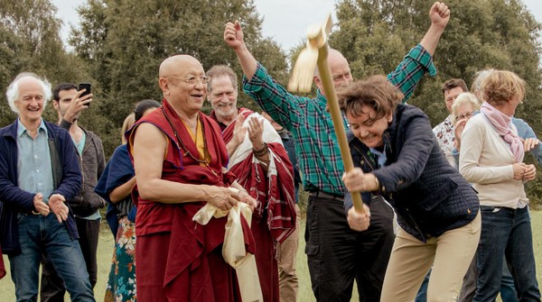 Buddhist Temple UK breaking ground Tibetan Buddhist Meditation Master and group of volunteers breaking ground to build foundations of a Buddhist Temple in the UK.