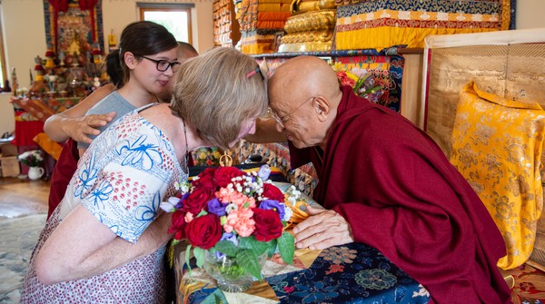 Chokyi Nyima Rinpoche with a Buddhist practitioner