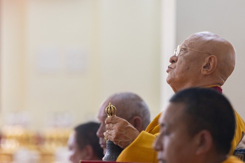 Chokyi Nyima Rinpoche with Buddhist bell and dorje.