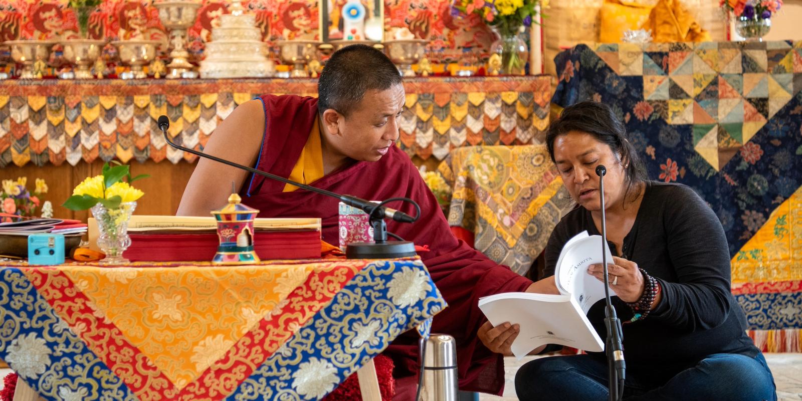 Buddha Dharma teacher Lama Oser and Tibetan - English translator Shireen in the meditation hall at Gomde UK.