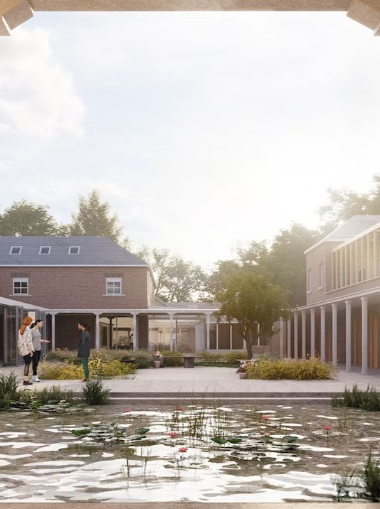 A beautiful winter courtyard, centred around a tranquil pond and sheltered walkway.