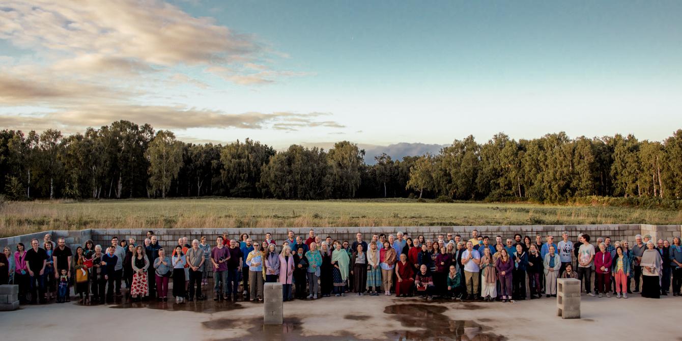 Our Buddhist community Group photo at Gomde UK, inside the foundations of the new Buddhist Temple in Yorkshire, UK.