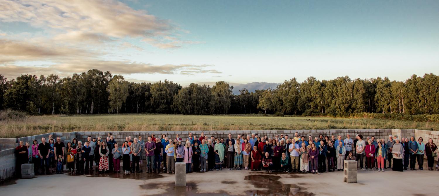 Our Buddhist community Group photo at Gomde UK, inside the foundations of the new Buddhist Temple in Yorkshire, UK.