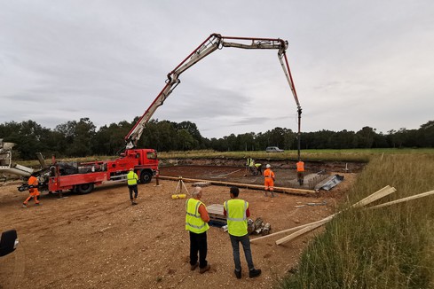 Buidling crane at work in fields.