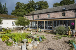 Coach House for meals and relaxation between Buddha Dharma teachings.