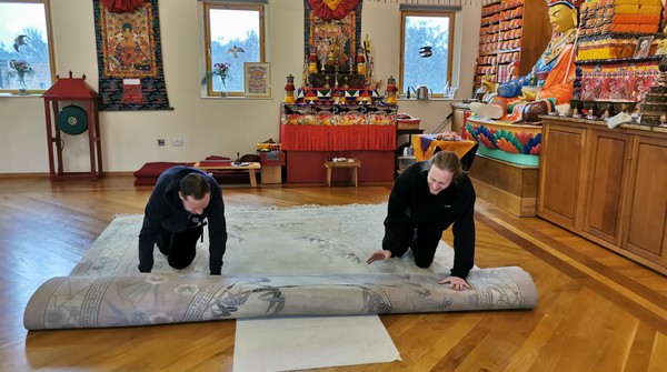 Preparing gompa Buddhism Preparations for seminar on Buddhism in meditation hall.