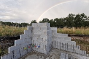 Rainbow and prayer flags at the foundations of the new Buddhist temple in England, UK.