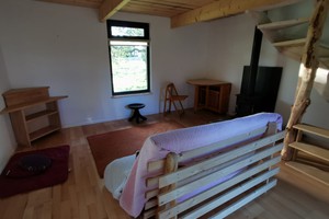 Sofa and window with great views for meditation at solitary individual retreat hut