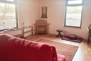 solitary retreat hut Room with sofa and big window for meditation at solitary retreat hut.
